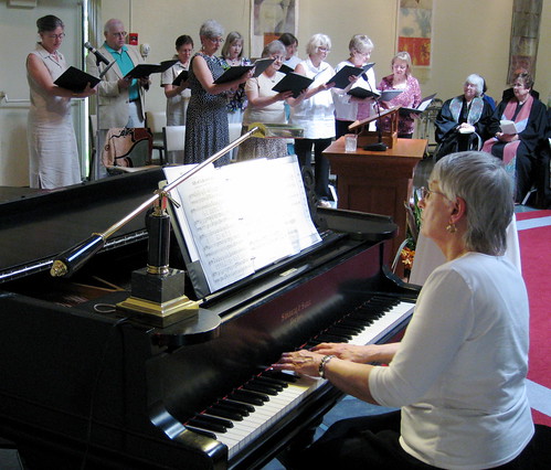 Music director Judy Putnam and the NSUU Singing Group.